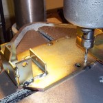 Tapping thread holes in metal